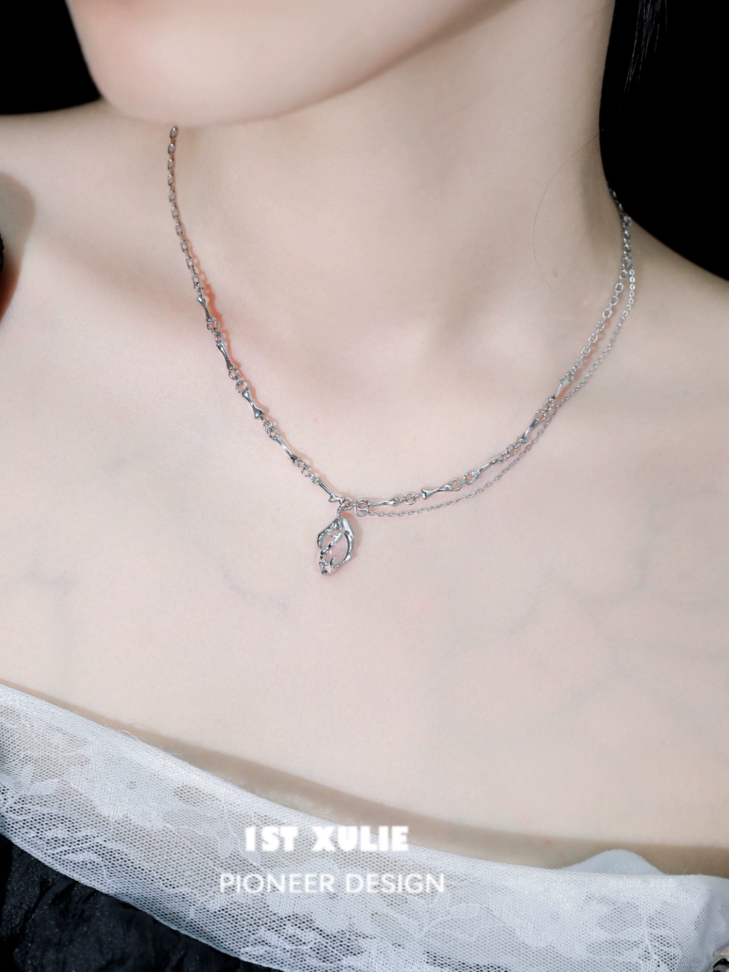 Unique summer pendant necklace with a delicate leaf design on a two-layered silver chain