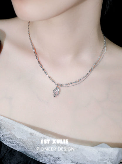 Unique summer pendant necklace with a delicate leaf design on a two-layered silver chain