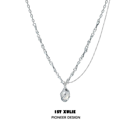 1ST XULIE unique summer pendant necklace in silver with a delicate, artistic design