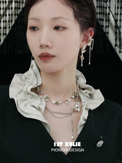Elegant model showcasing a vintage rose necklace paired with stylish earrings from 1STXULIE