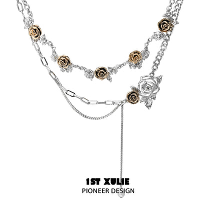 Vintage rose necklace featuring silver and gold dual-tone roses and a unique chain design