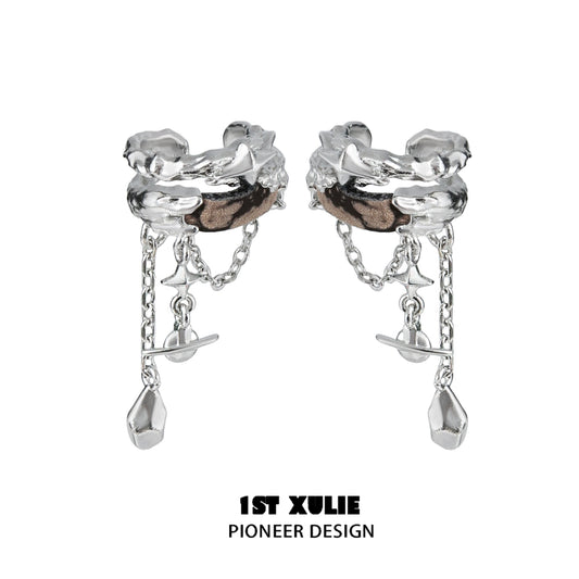 Wasteland ear cuff earrings by 1STXULIE with a unique design featuring chains and metallic details