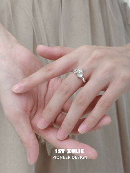 Elegant white agate butterfly silver ring featured on a model's hand with delicate design