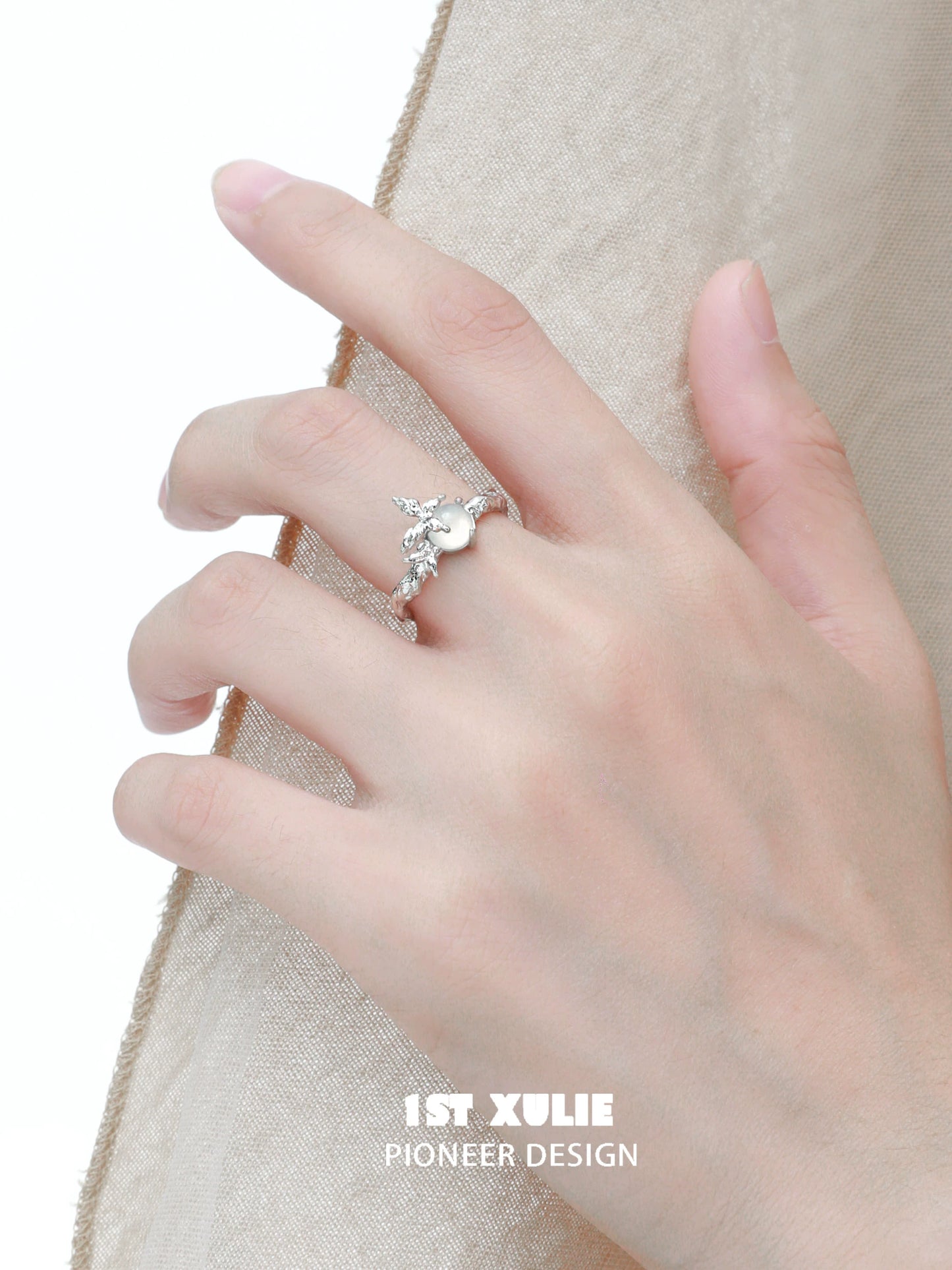 Elegant white agate butterfly silver ring worn on a hand with a delicate design