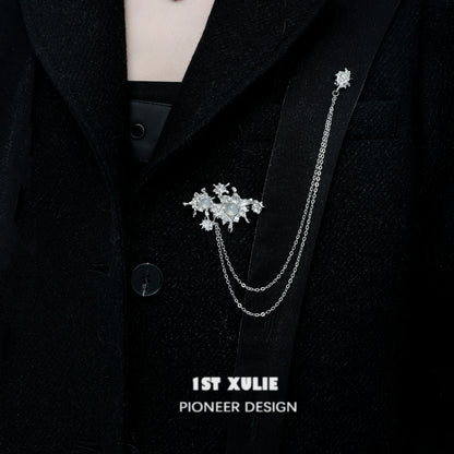 Elegant silver chain brooch featuring white agate stones, perfect for adding style to jackets