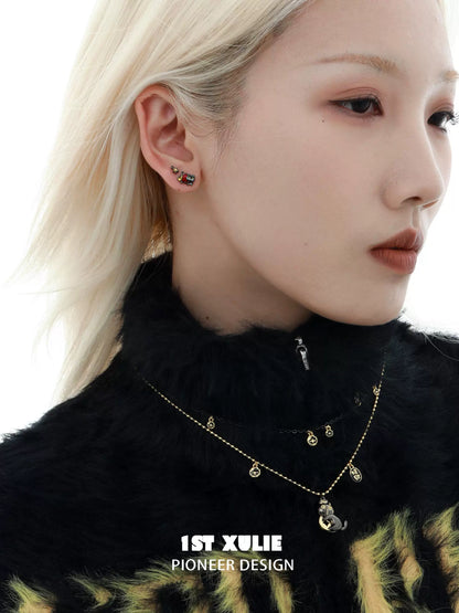 Y2K black cat earrings with a playful design worn by a model in stylish attire