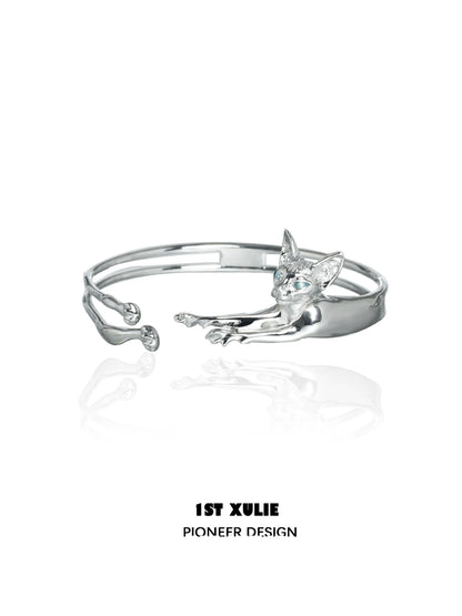 Silver Y2K cat bracelet featuring a playful cat design with blue gemstones for a trendy look
