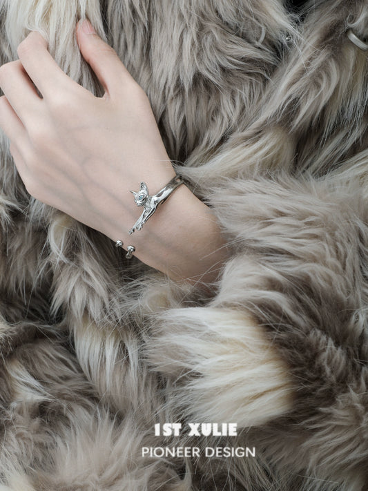Stylish Y2K cat bracelet by 1STXULIE featuring a whimsical feline design on a metallic band