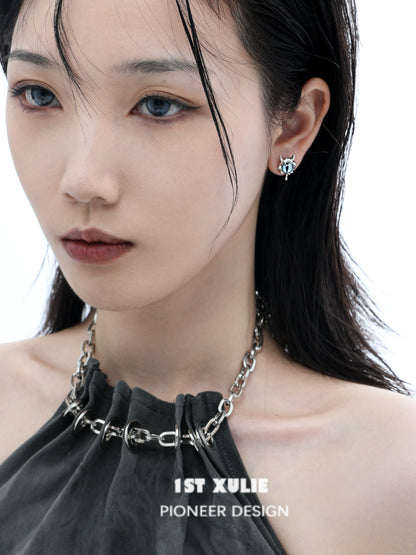 Stylish Y2K demon eye earrings worn by a model with a smoky look and sleek hairstyle