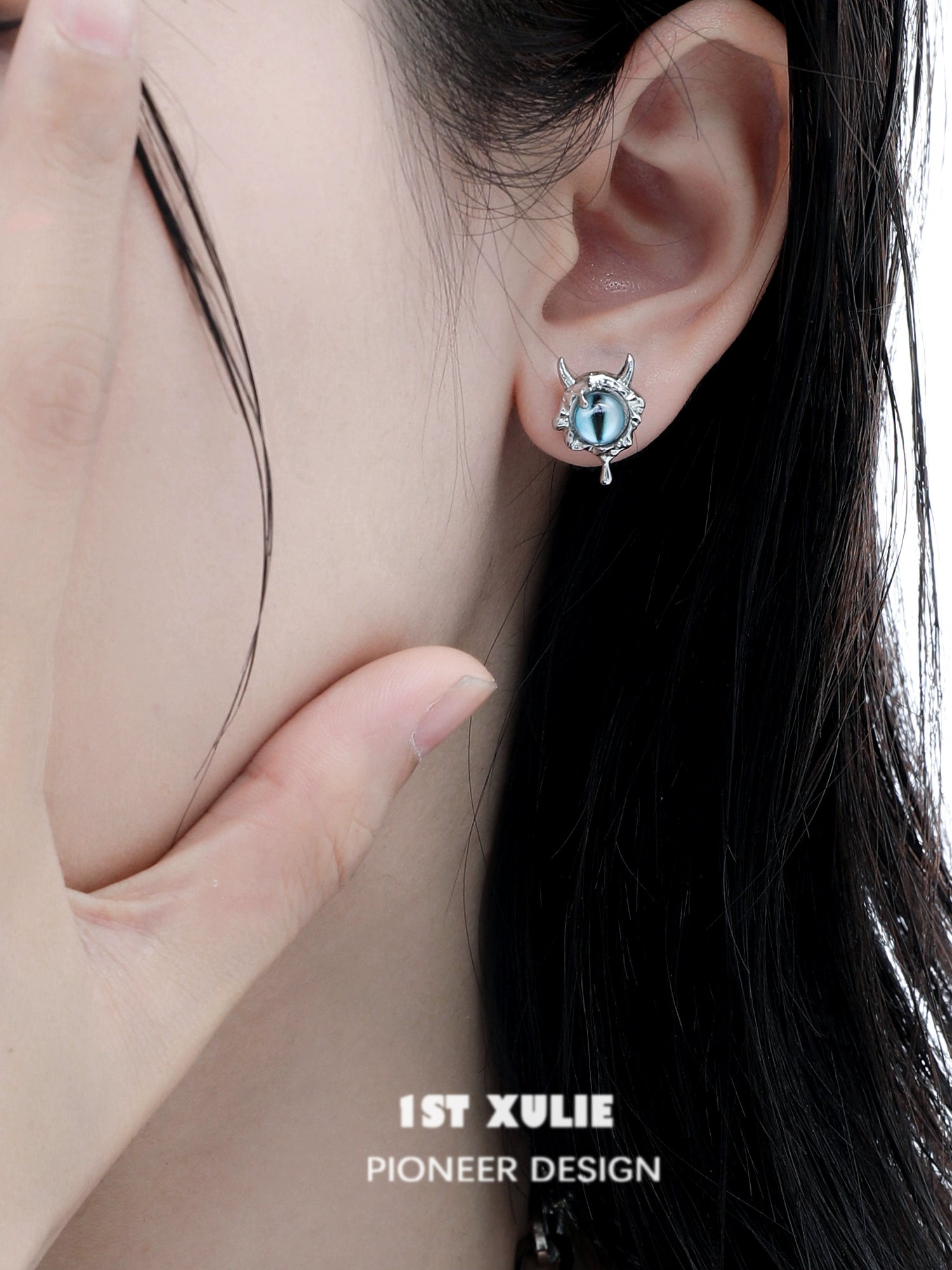 Y2K demon eye earrings featuring unique design with devil horns and turquoise eye detail
