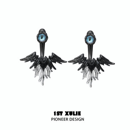 Y2K devil wing earrings featuring a striking black and white design with an eye detail
