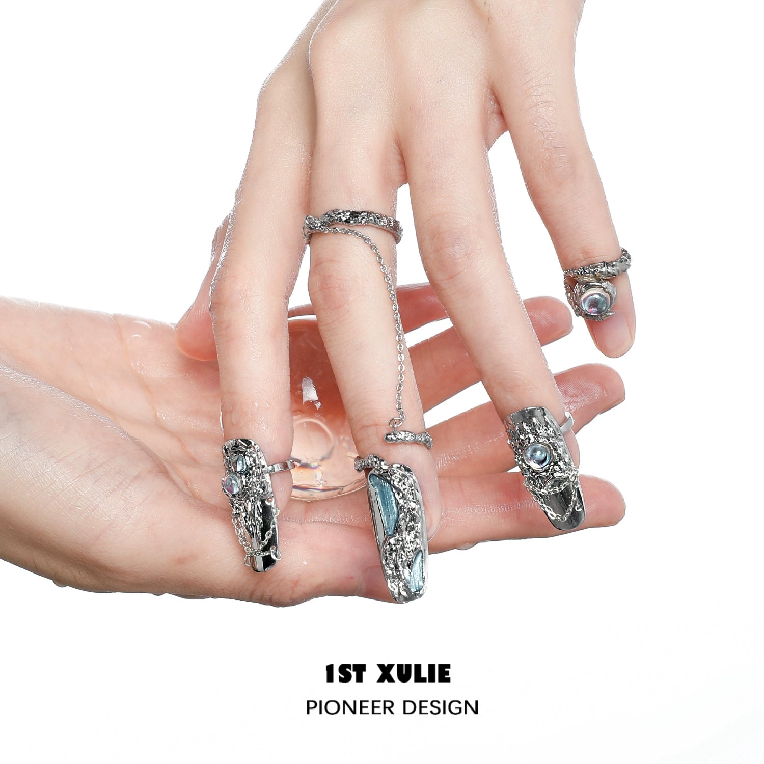 Y2K fairy nail chain ring with intricate silver design showcased on decorated nails