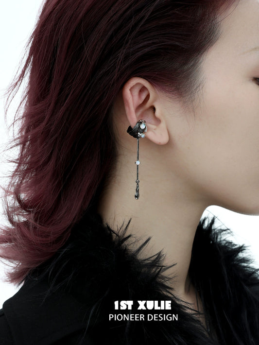 Y2K feather tassel ear clip featured on a model with a stylish look