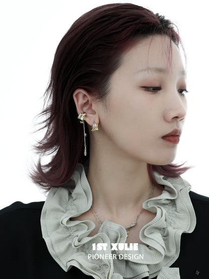 Y2K feather tassel ear clip showcasing a unique design worn by a model with stylish hair