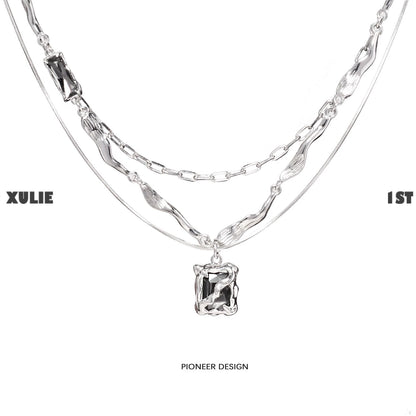 Y2K frost gem necklace featuring layered silver chains and a unique pendant design
