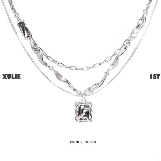 Y2K frost gem necklace featuring layered silver chains and a unique pendant design