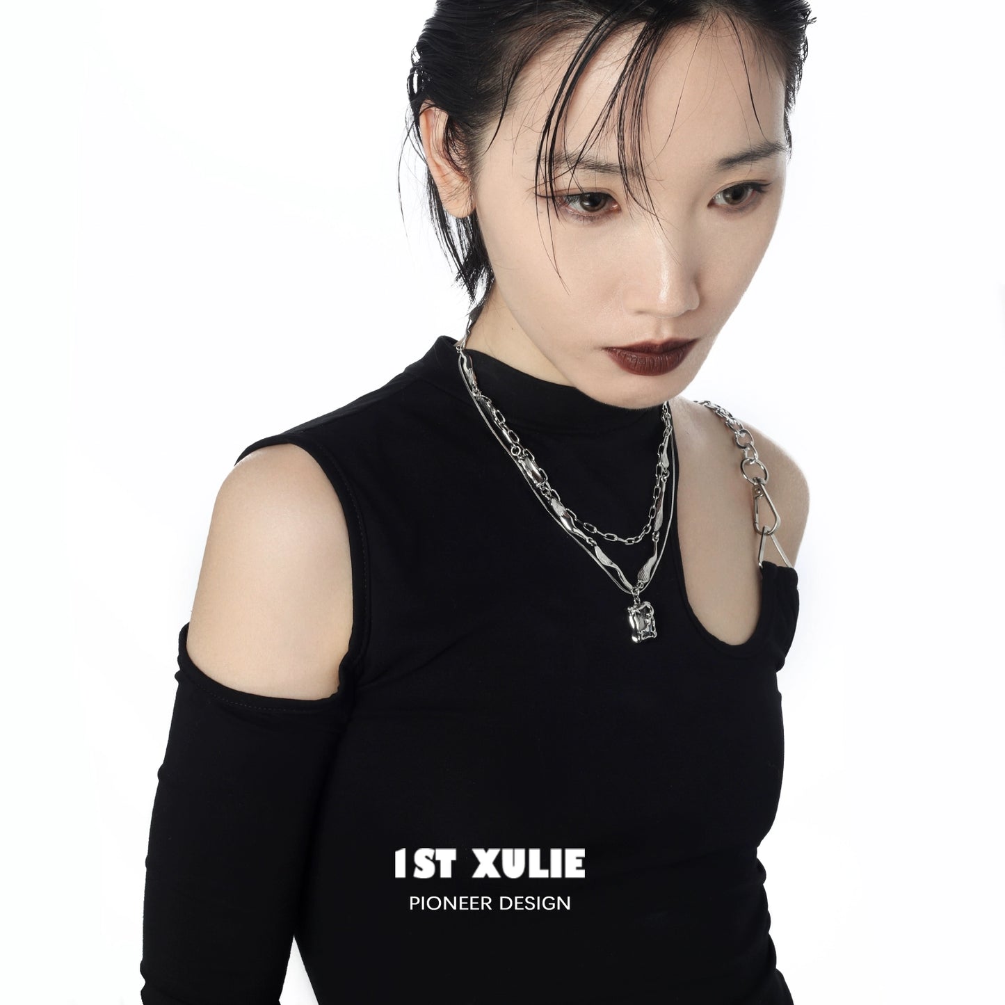 Stylish Y2K frost gem necklace layered with silver chains on a model wearing a black top