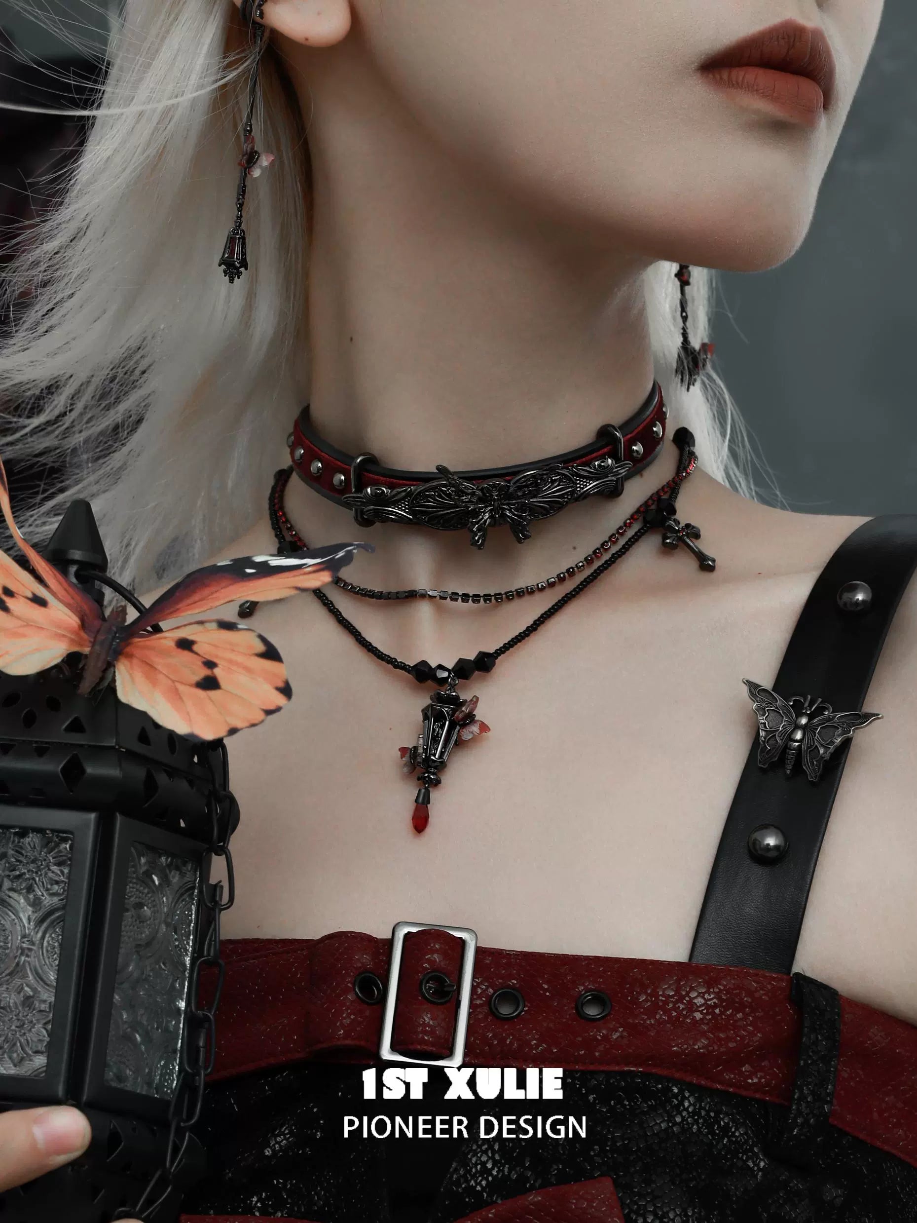 Y2K gothic butterfly necklace layered with red accents for a trendy gothic look