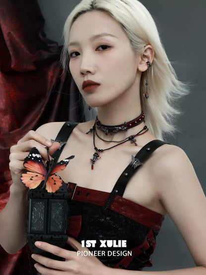 Y2K gothic butterfly necklace showcased on model with edgy attire and bold makeup