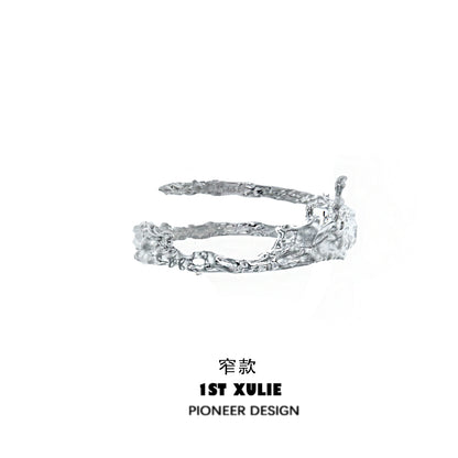 Y2K liquid metal arm bracelet in silver with a unique sculptural design by 1ST XULIE
