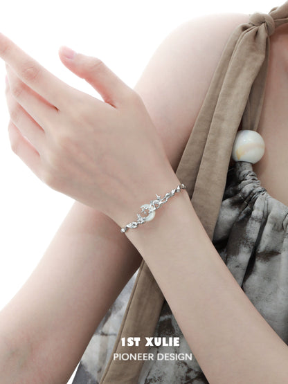 Y2K moon orchid silver couple bracelet displayed on a wrist with stylish design