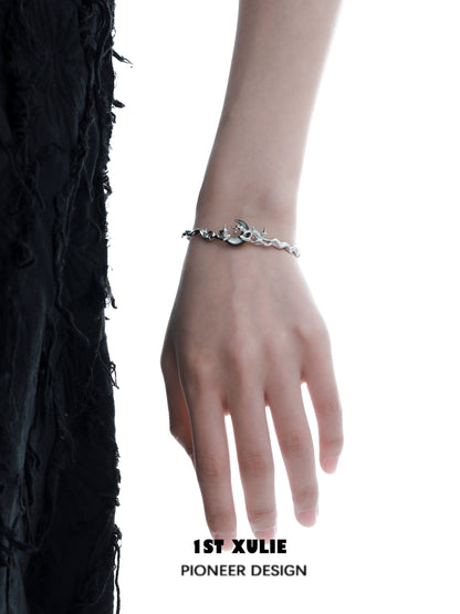 Y2K moon orchid silver couple bracelet on a model's hand showcasing its unique design