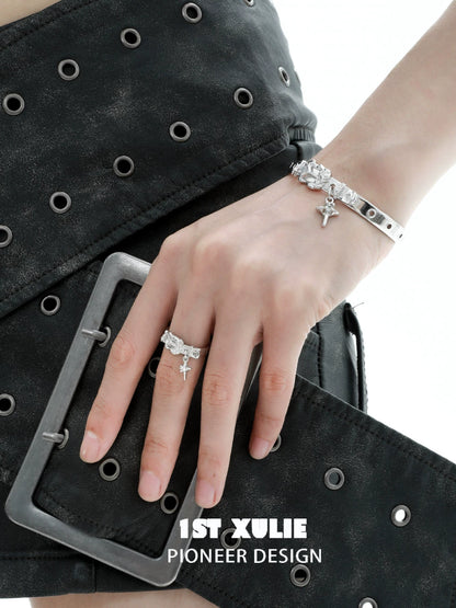 Fashionable Y2K silver belt buckle ring worn on hand with stylish black skirt
