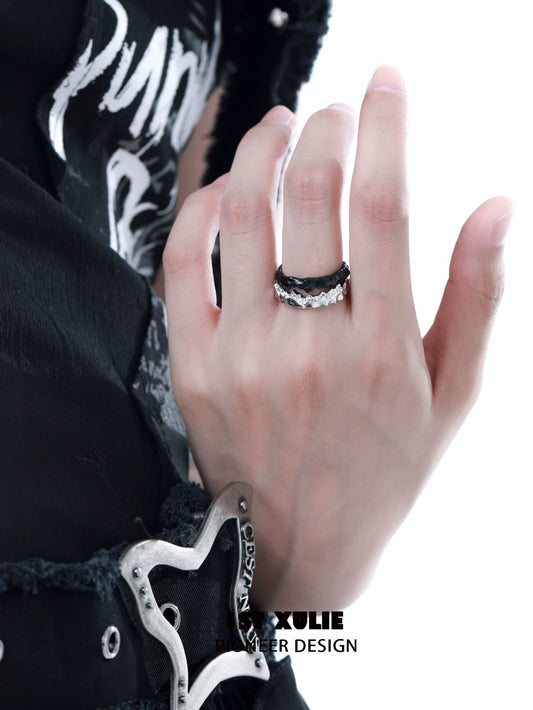 Y2K silver couple ring displayed on hand with black outfit, showcasing its modern design and style