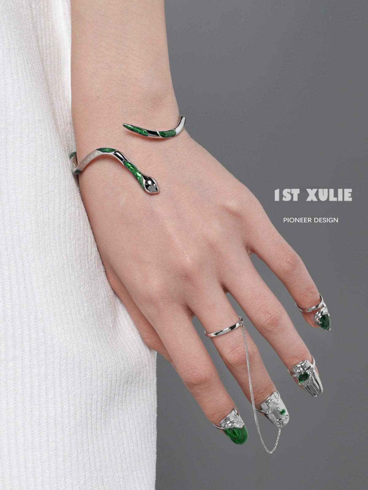 Y2K Slytherin snake bracelet featuring green accents and a sleek design on a model's wrist