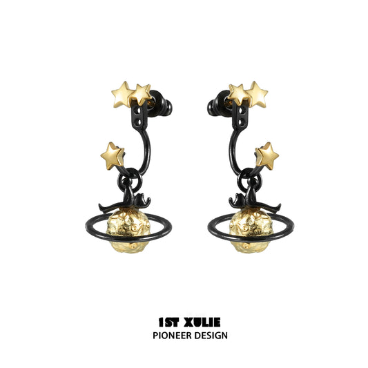Y2K star earrings featuring gold stars and planet design on black metal hoops