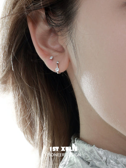 Elegant zircon stud earrings for women showcased on a model's ear for a stylish look