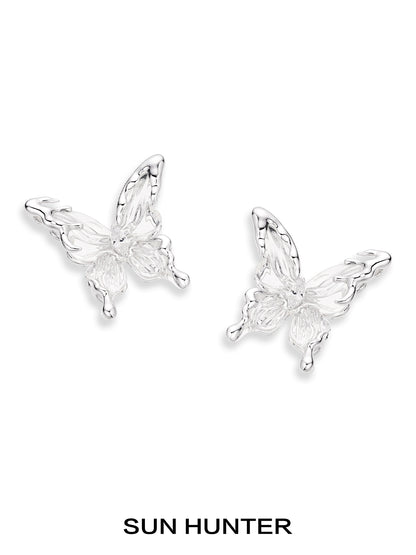 Elegant SUN HUNTER 3D butterfly earrings in silver for a stylish and whimsical look