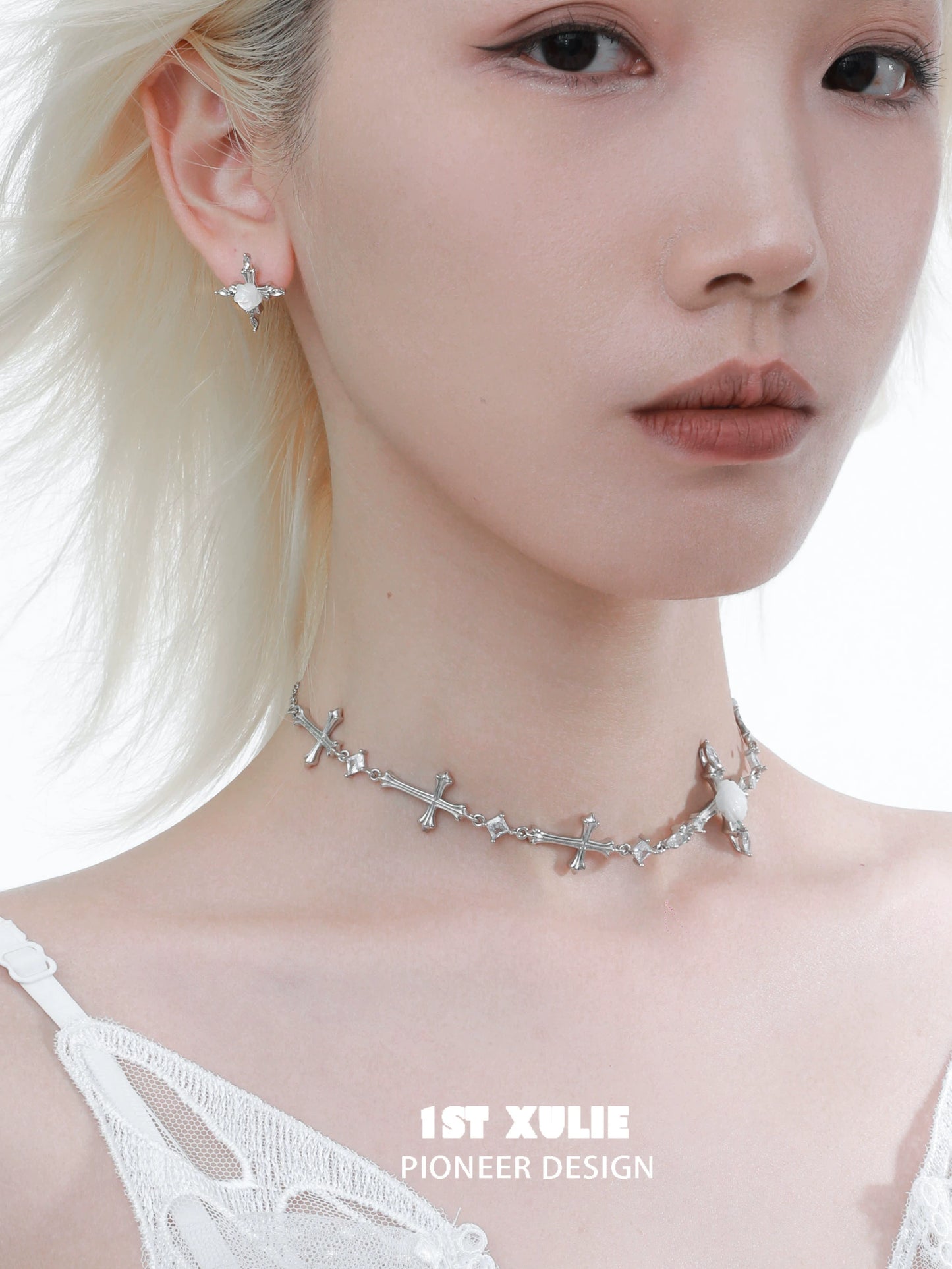Elegant silver rose cross necklace paired with matching earrings for a stylish look