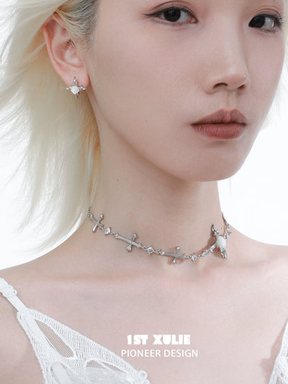 Elegant silver rose cross necklace paired with matching earrings for a stylish look