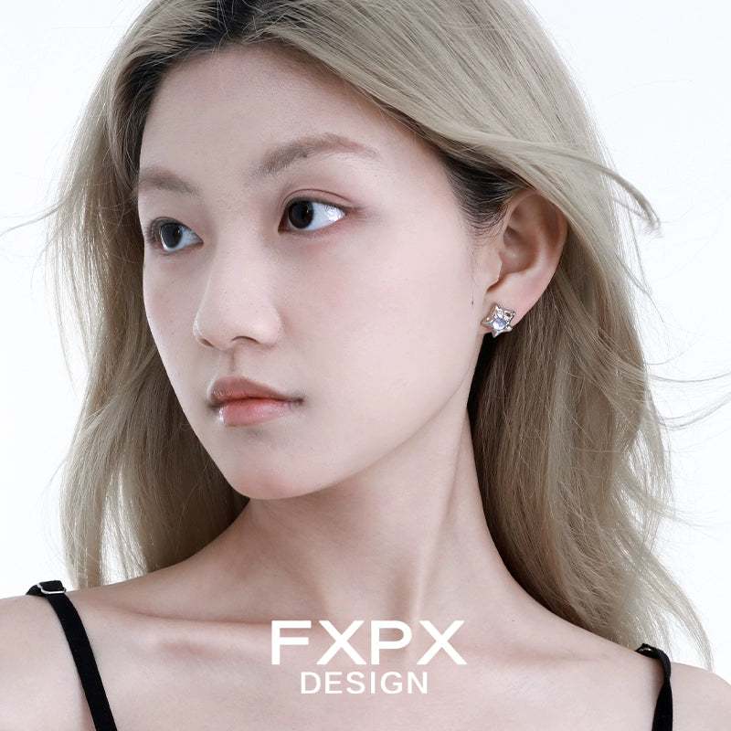 Model wearing FXPX Y2K star earrings that sparkle with vintage charm and style