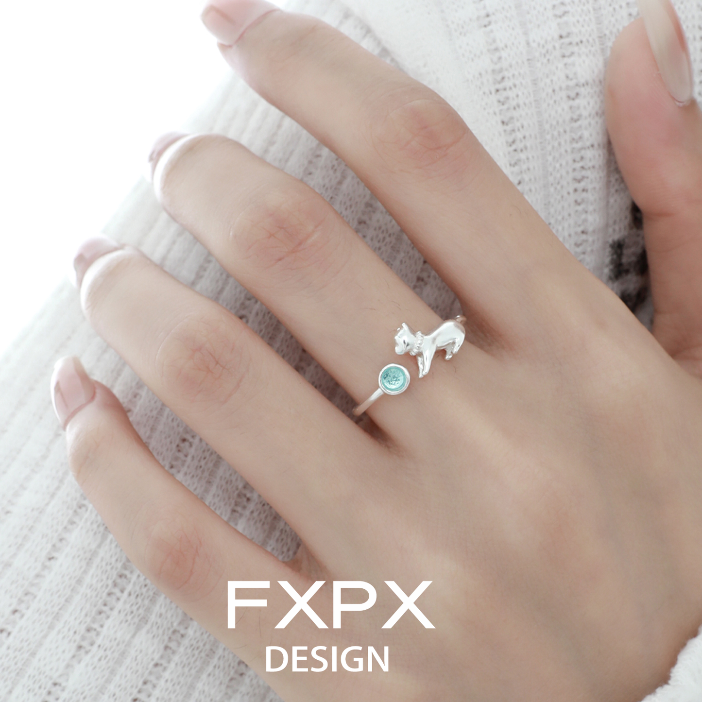 Cute blue cat ring by FXPX featuring a silver cat design and a blue gemstone accent