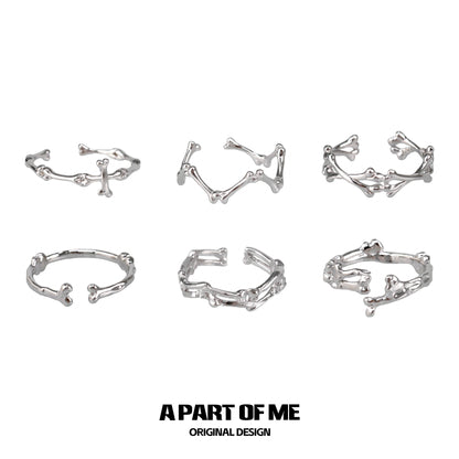 Set of six abstract bone silver rings from A PART OF ME featuring unique skeletal designs