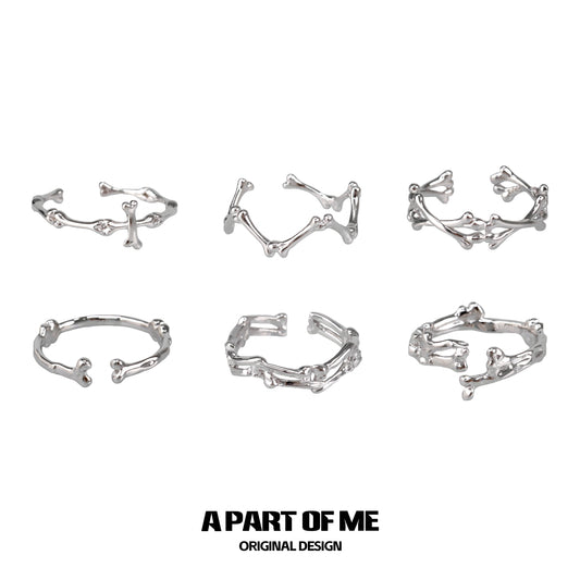 Set of six abstract bone silver rings from A PART OF ME featuring unique skeletal designs