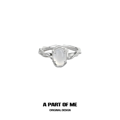 Sterling silver agate textured ring featuring a smooth oval gemstone centerpiece