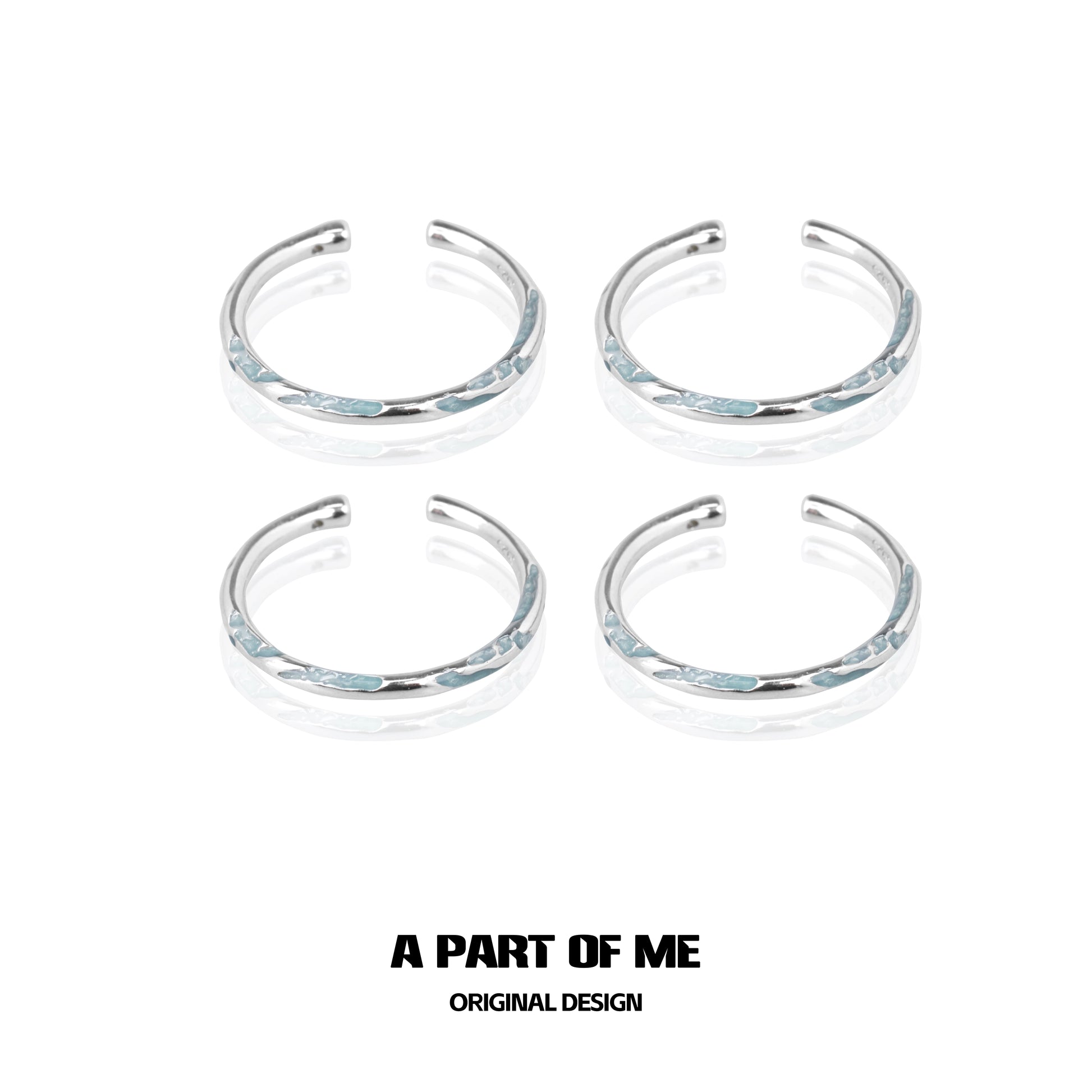 Set of four A PART OF ME blue minimalist rings with sleek silver accents for stylish wear