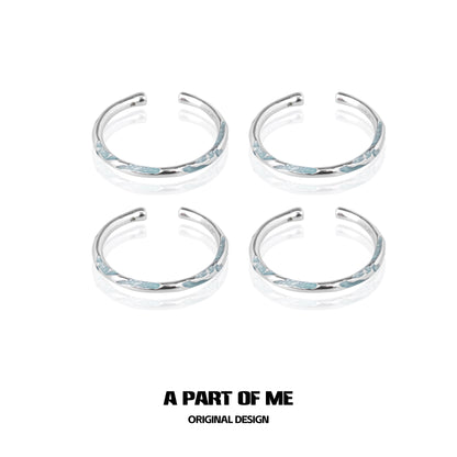 Set of four A PART OF ME blue minimalist rings with sleek silver accents for stylish wear