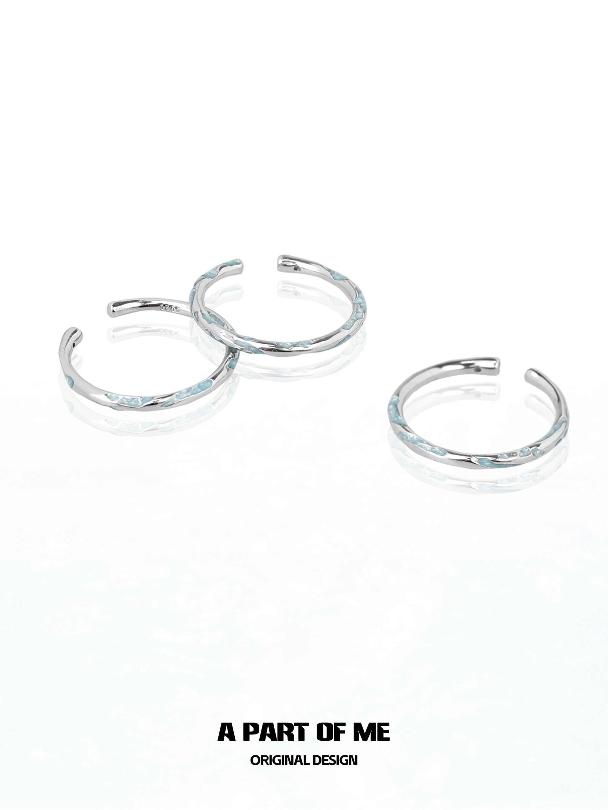 Set of three A PART OF ME blue minimalist ring designs with a sleek silver finish