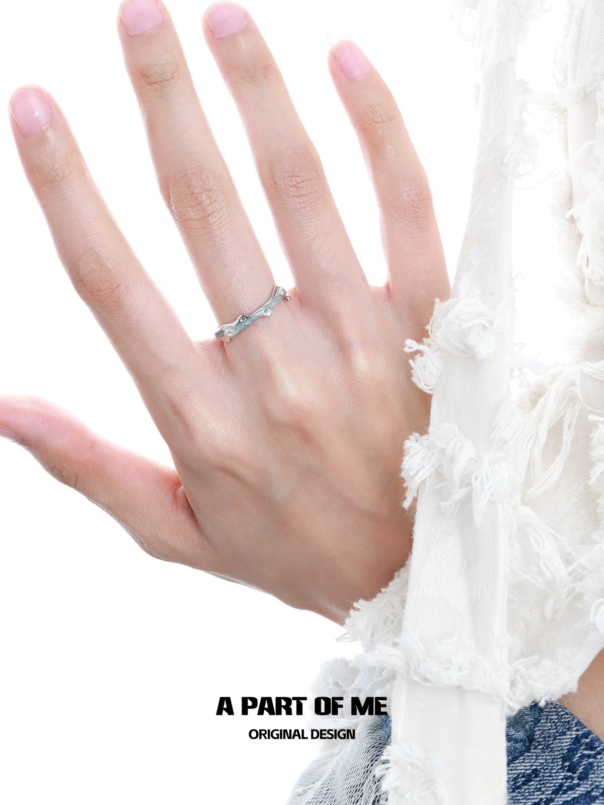 A Part of Me blue star ring on a hand, featuring a unique and elegant design