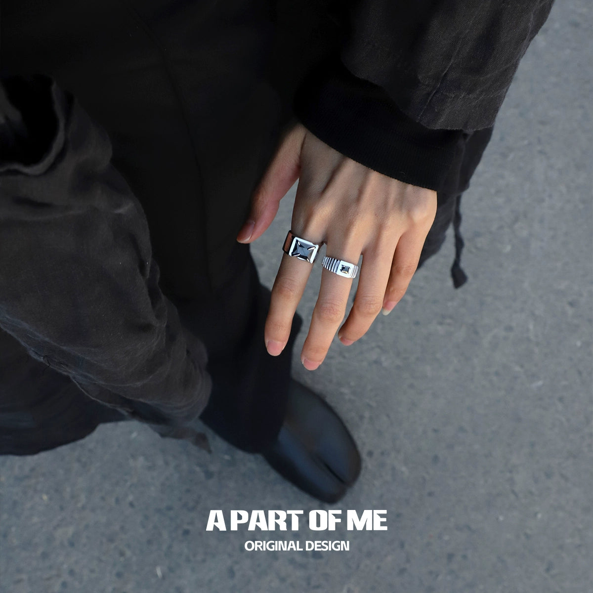 Bold stone hip-hop ring displayed on a person's hand, showcasing its unique design and style.