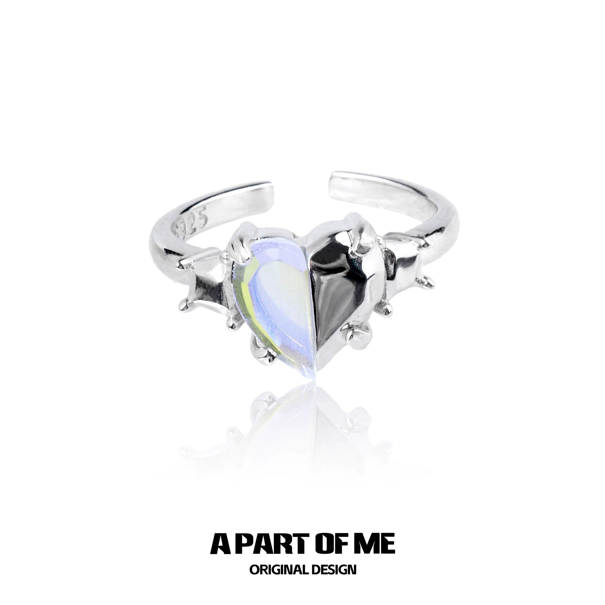 A PART OF ME color changing armor ring featuring a heart-shaped dual color gemstone in a silver setting
