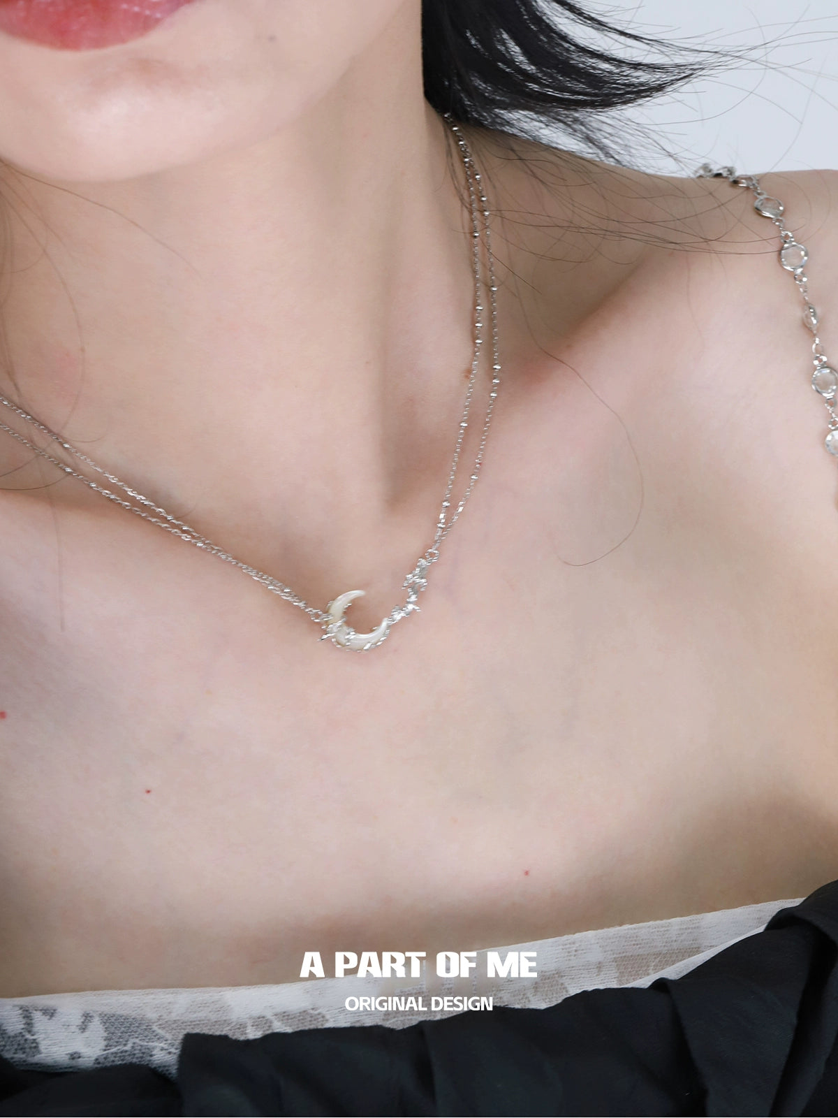 Silver crescent moon necklace featuring delicate bead accents for an elegant look