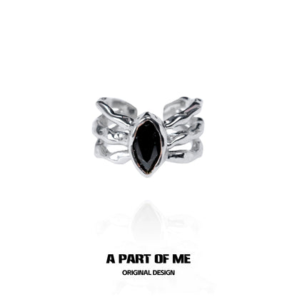 Dark queen finger guard ring featuring a black marquise stone and unique silver design
