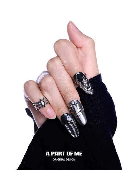 Dark Queen Finger Guard Ring by A PART OF ME worn on stylish nails with intricate design.