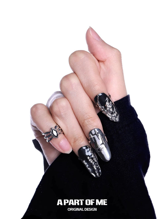 Stylish dark queen finger guard ring showcased on a hand with dark nail art and black clothing