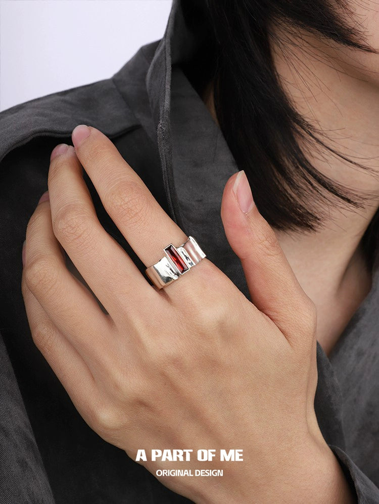 A reflective edgy gothic ring worn on a hand, showcasing a bold design for unique style.